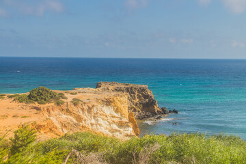 Fototapeta na wymiar Sea and Mountain at Ras Hammam Beach. Cliff Views and Natural Beauty in Tunisia