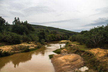 Fototapeta na wymiar Polluted River in the Mountain at Cap Serrat, Bizerte, Tunisia