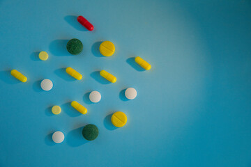 Coloured tablets on a blue background