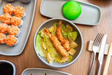  Asian salad with tempura shrimp and pistachios.