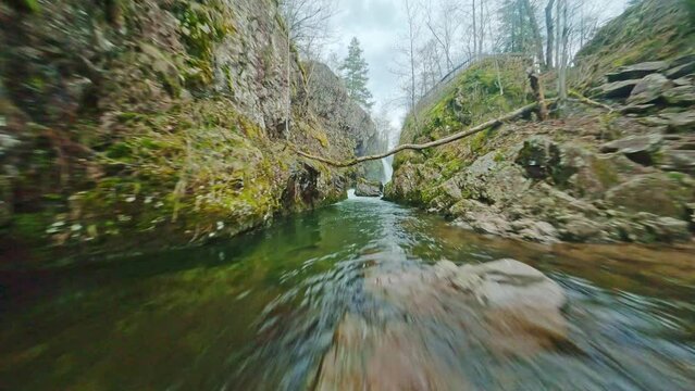 fov drone flying above ognon river and waterfall in Vosges region France