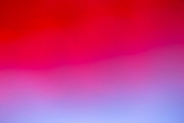 Background with color transitions from red to blue. Bokeh background with bright color gradients.