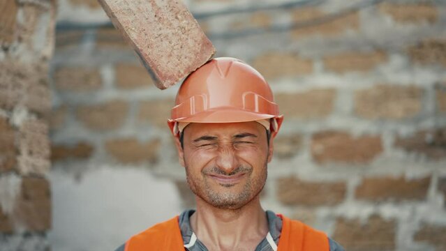 Brick falls on a builder's head