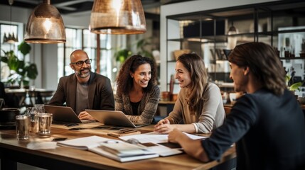 business people or coworkers gathered around a table working