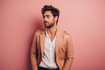 Fototapeta premium Portrait of a jovial man in his 20s sporting a stylish leather blazer against a solid pastel color wall. AI Generation