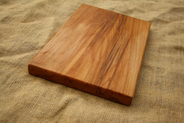 Beech cutting board lies on burlap