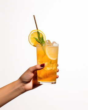 Woman Hand Holding A Glass Of Juice Or Iced Tea With Ice Cubes And A Slice Of Lemon, Fresh Cocktail For Summer