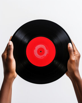 Top view hands holding a a back and red vintage vinyl, isolated on a white background, retro record concept 