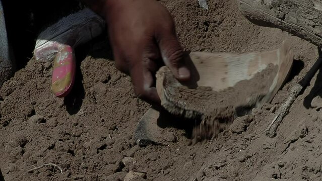 Archaeologist Brushing Ancient Clay Pottery Artifact During Archaeological Excavation - Close Up