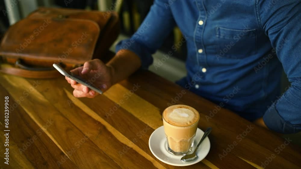 Sticker Hands, phone and coffee with a customer in a restaurant closeup from above for social media or communication. Mobile, contact or networking and a person in a cafe with a caffeine beverage to relax