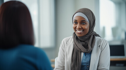 professional black muslim woman in office wearing headscarf  - obrazy, fototapety, plakaty