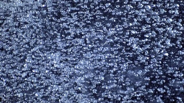 Full Frame close shot of bubbling air rising in clean water. 3d animation loop background for abundance of clear drinking water and concept of boiling or purity and freshness. Isolated flowing soda.