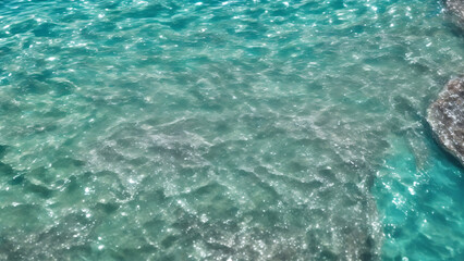 Fototapeta na wymiar Summer clear water, shore, beach, sunlight, ripple reflection, transparency
