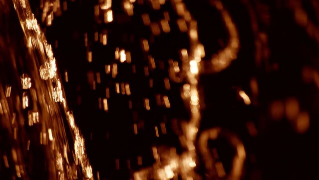Golden orange full frame macro close up of oil fluid as defocused loop background. Concept 3D animation backdrop for lubricant liquids or alcoholic beverage showcase background with copy space.