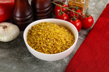 Dry wheat bulgur cereal heap