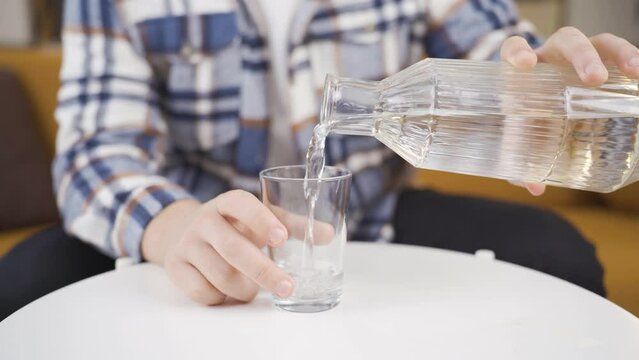 Water and jug, a glass of water.