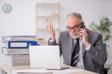 Old male employee and too much work in the office