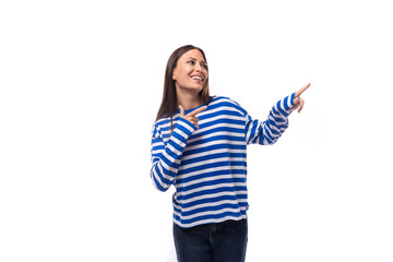 young smiling slender european brunette woman dressed in a casually striped sweater