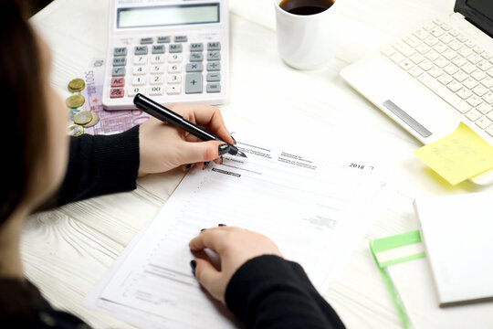 Accountant fill german tax form Einkommensteuererklarung in end of tax period. Taxation and paperwork routine in Germany