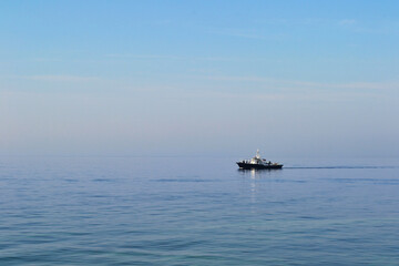 Baltiysk, Kaliningrad region, Baltic spit, ship in the Baltic Sea, water surface to the horizon