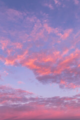 Sunrise, sunset pink blue evening sky with clouds background texture