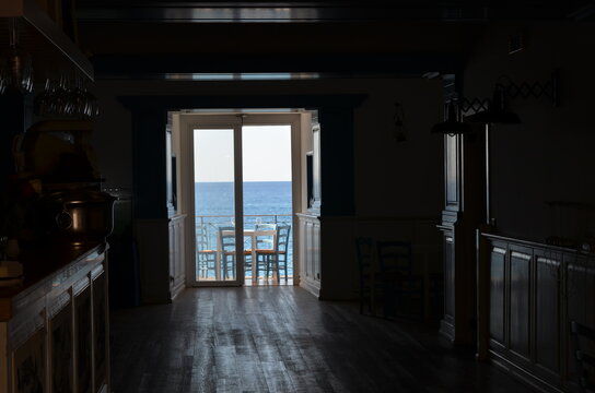 view of the sea from a dark room