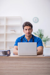 Young male doctor in telemedicine concept
