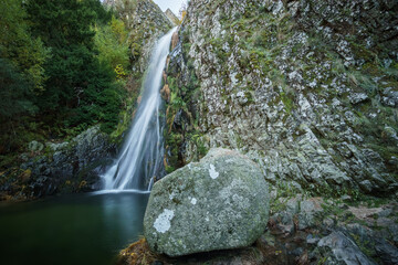 Waterfall called Poco do Inferno with water pool during autumn time, Manteigas, Serra da Estrela,...
