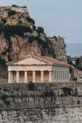 Fototapeta na wymiar temple of apollo in delphi corfu greece with mountain behind