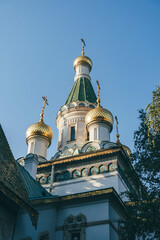 Fototapeta na wymiar church of the holy trinity in bulgarian city with green towers