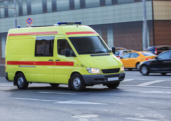 Ambulance Car Driving Down a City Street Close-up