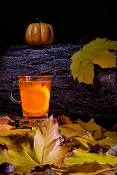 mulled beer with spices and pumpkin on top in halloween concept