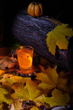 mulled beer with cloves and orange slice in halloween style