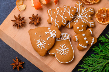 Beautiful festive Christmas composition of tangerines, gingerbread and star anise