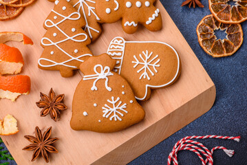 Beautiful festive Christmas composition of tangerines, gingerbread and star anise