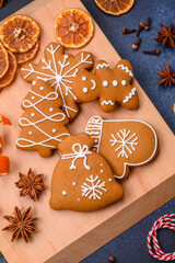 Beautiful festive Christmas composition of tangerines, gingerbread and star anise
