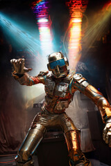 Fototapeta premium Man dancing in disco. Man dressed in Futuristic Silver Suit. Robot suit.