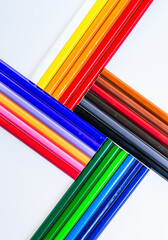 A Colorful Tower of Artistic Inspiration. A group of colored pencils laying on top of each other