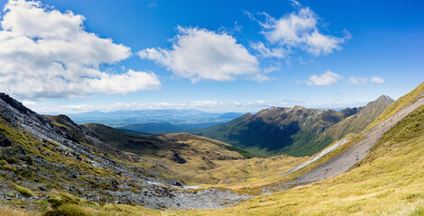 Panoramic view from the Kepler track with mountains and forest on a sunny day in New Zealand