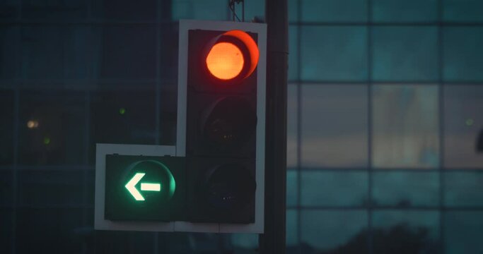 Traffic light turning green in city at night, close up