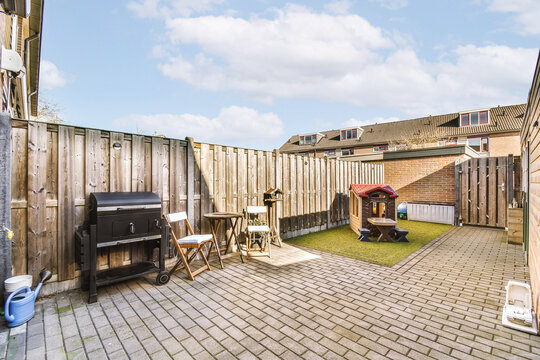 Backyard with furniture and barbeque