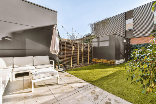 Backyard with furniture and grassy lawn and shed