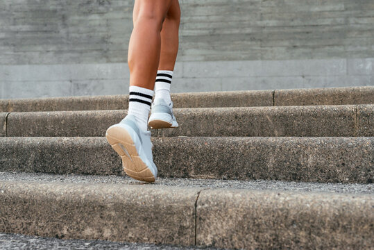 Active Woman Climbing Stairs Outdoors