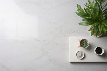 Create a top view of a sleek study desk with keyboard, tablet, coffee, and plants on marble, leaving room for text.