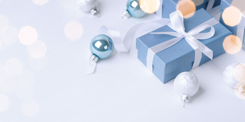 Fototapeta na wymiar Christmas blue gifts with decorations on white background