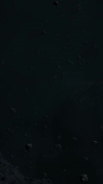 Asteroid belt field in dark outer space. 3D animation wide pan shot. Rock formations of cosmic debris and giant Meteorites. Celestial objects on starry stars background with dust nebula haze low light