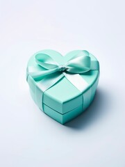 Fototapeta premium Blue heart shaped gift box with ribbon and bow.