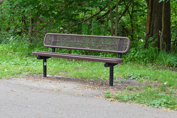 Park Bench and Greenery on a Sunny Spring Day