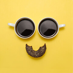 Coffee creative happy emoji. Smile from two cups of black espresso and healthy raw donat as mouth....