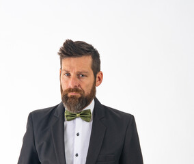 Handsome young white man groom with wedding black suit and bow tie isolated on white background